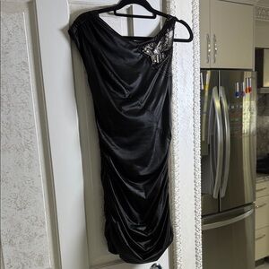 Elegant Black Dress with Embellished Shoulder